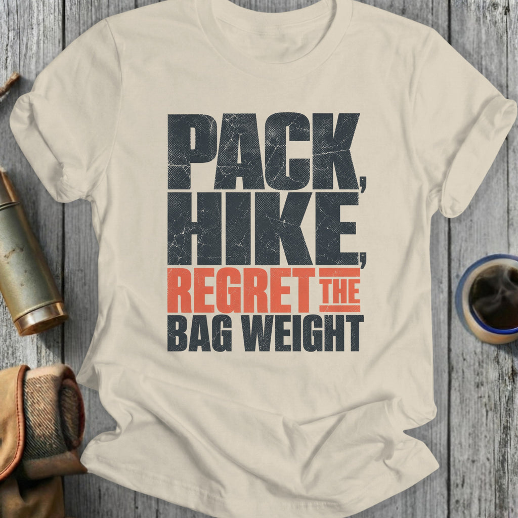 Cream t-shirt with "PACK HIKE REGRET THE BAG WEIGHT" text.