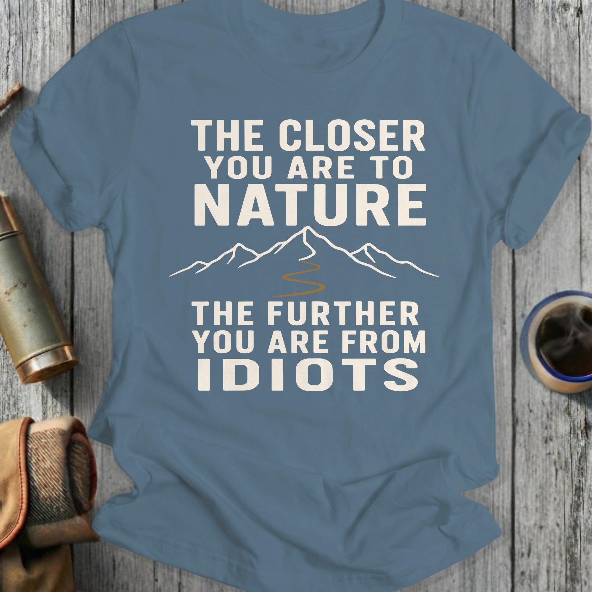 Blue t-shirt with text "The Closer You Are to Nature, The Further You Are from Idiots."