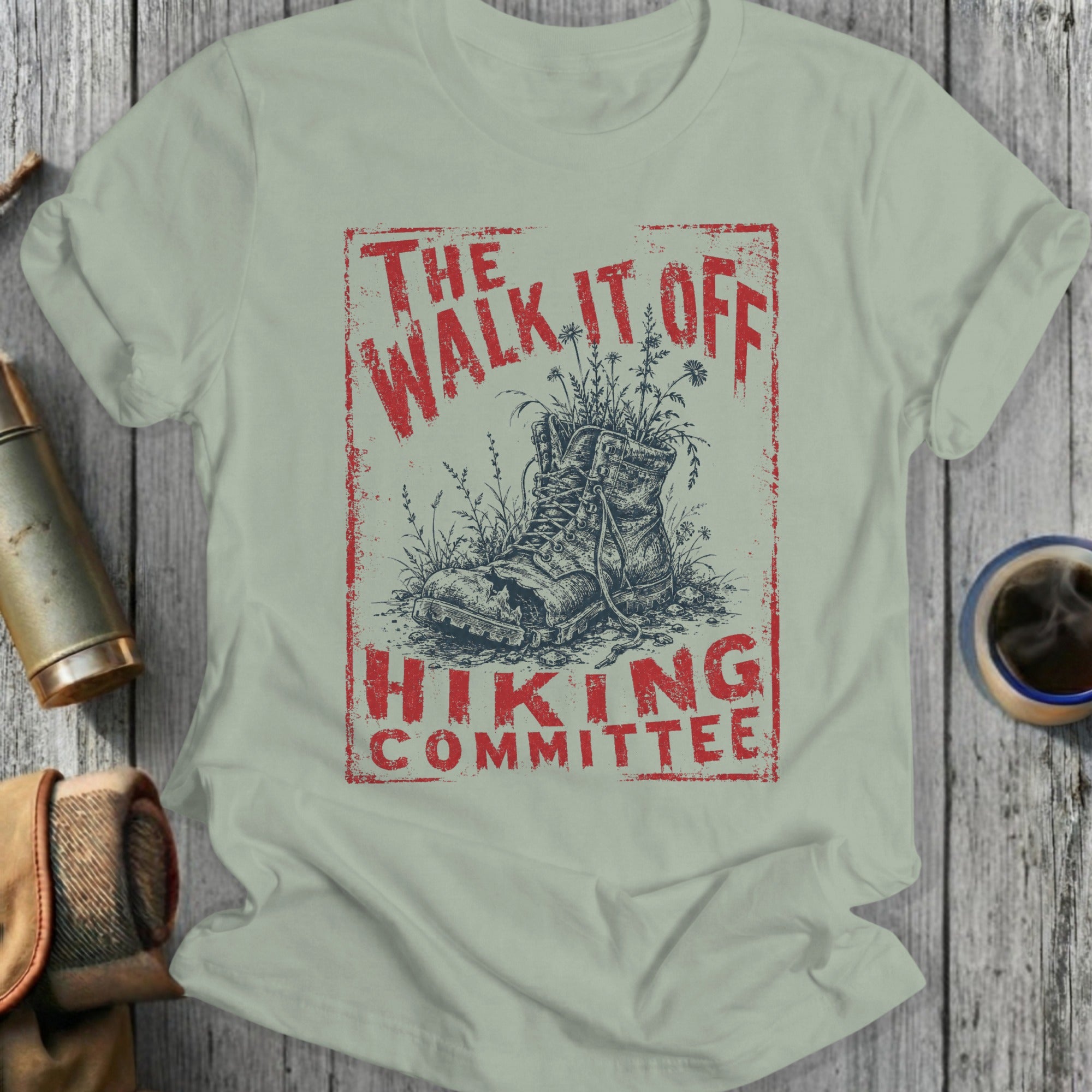 T-shirt graphic with weathered boot and text: "The Walk It Off Hiking Committee."