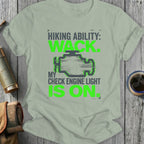 T-shirt with green text and check engine light graphic about hiking.