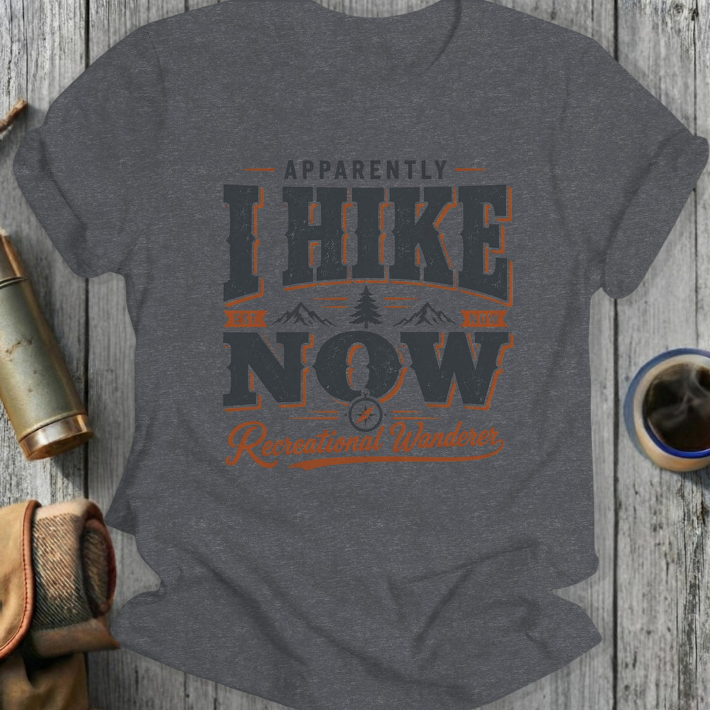 Dark gray t-shirt with "Apparently I Hike Now" text and mountain graphic.