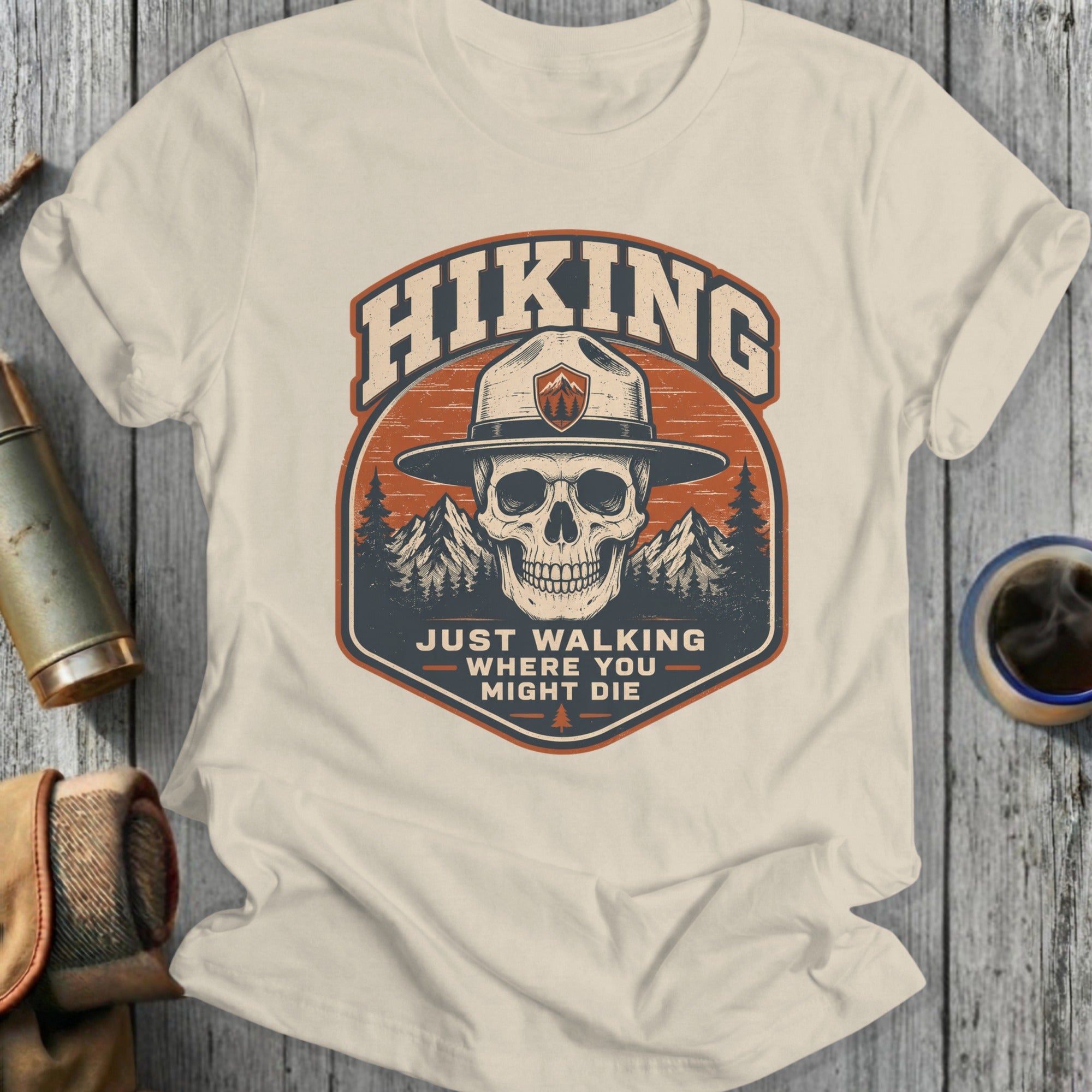 Hiking skull with compass logo and text "Just Walking Where You Might Die".