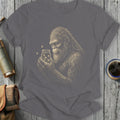 Bigfoot holding a jar of fireflies with a textured background and cup of coffee.