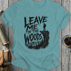 T-shirt with "Leave Me in the Woods" text over a hiker on a cliff.