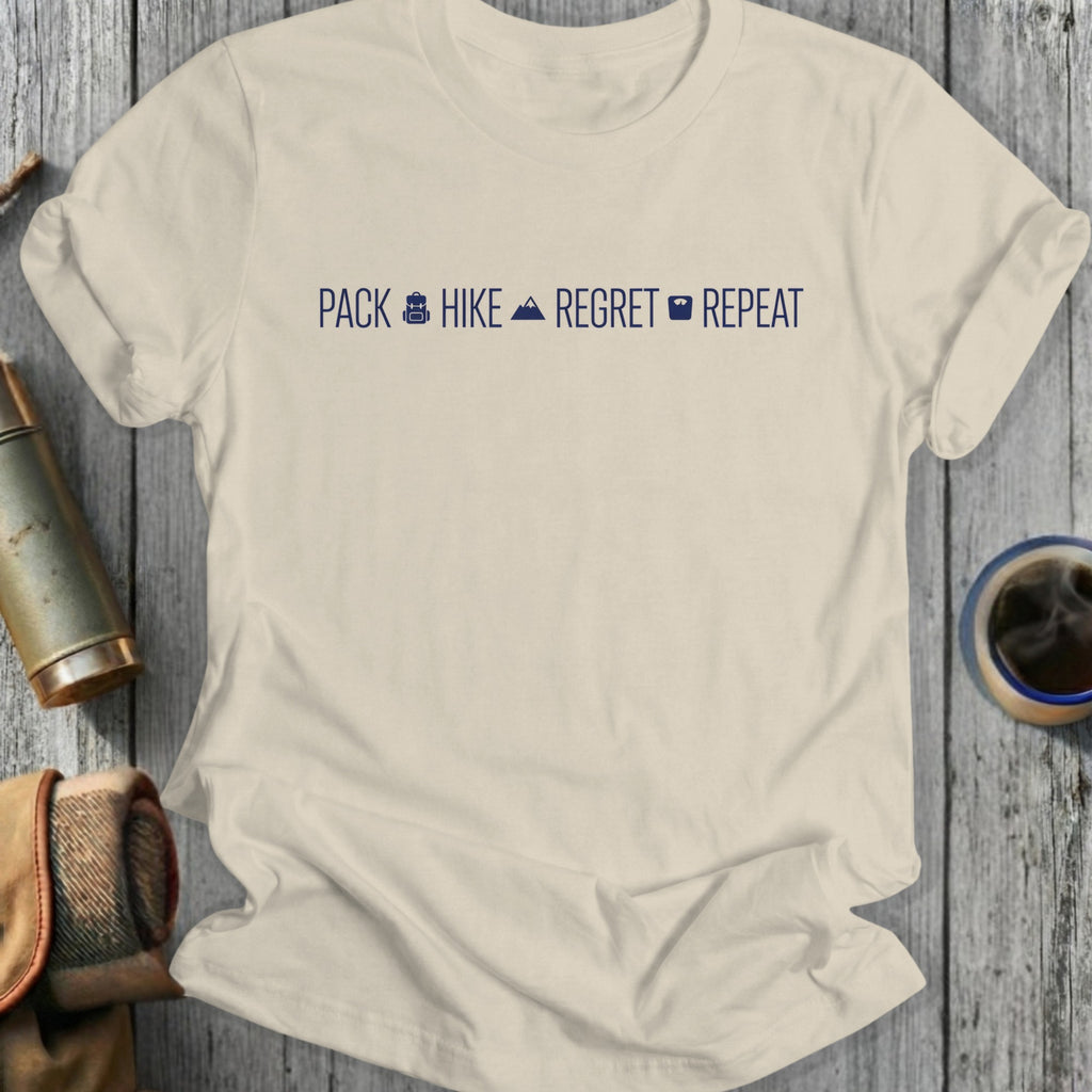 Light beige t-shirt with "PACK HIKE REGRET REPEAT" text and icons.