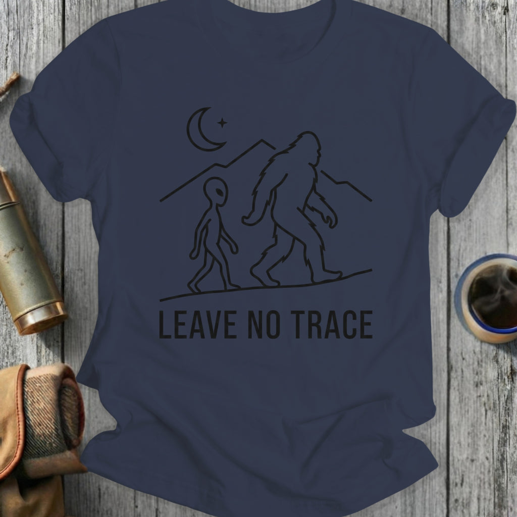 Bigfoot and alien silhouettes walking with mountains and moon, "LEAVE NO TRACE".