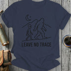 Bigfoot and alien silhouettes walking with mountains and moon, "LEAVE NO TRACE".
