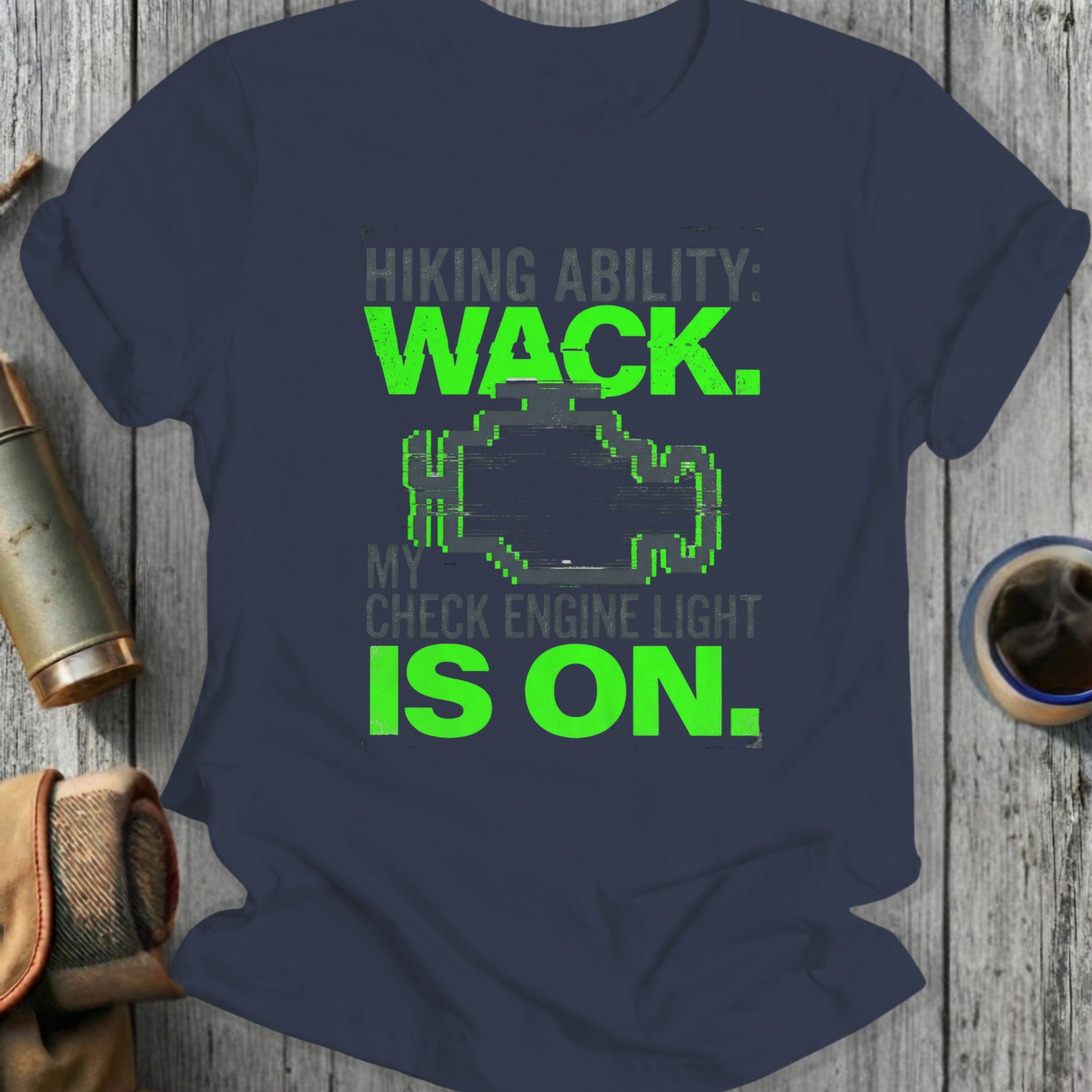 Navy t-shirt with glitchy check engine light graphic and "Hiking ability: Wack. My check engine light is on." text.