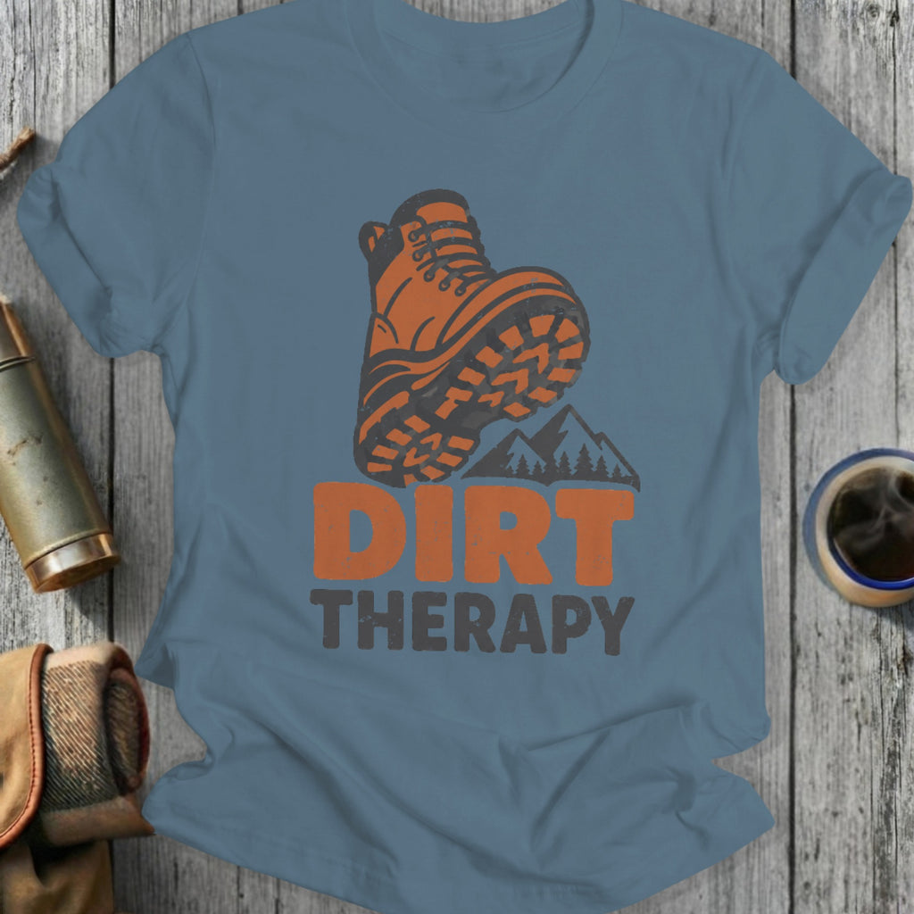 Orange hiking boot placed over mountains and the text "DIRT THERAPY."