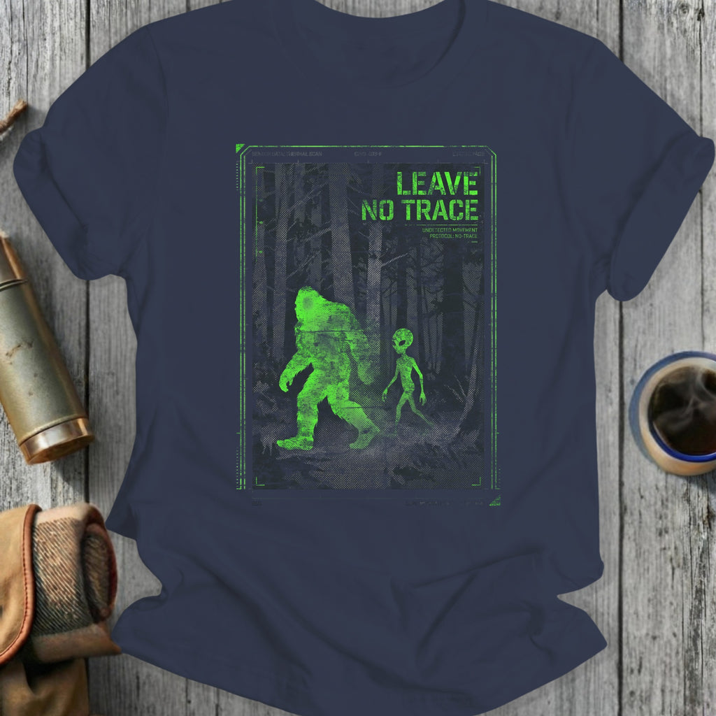Green Bigfoot and alien graphic with "Leave No Trace" text on a navy t-shirt.