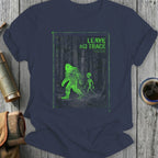 Green Bigfoot and alien graphic with "Leave No Trace" text on a navy t-shirt.