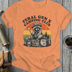 Feral Gen X Camping Club raccoon with marshmallow and vintage sunset graphic.