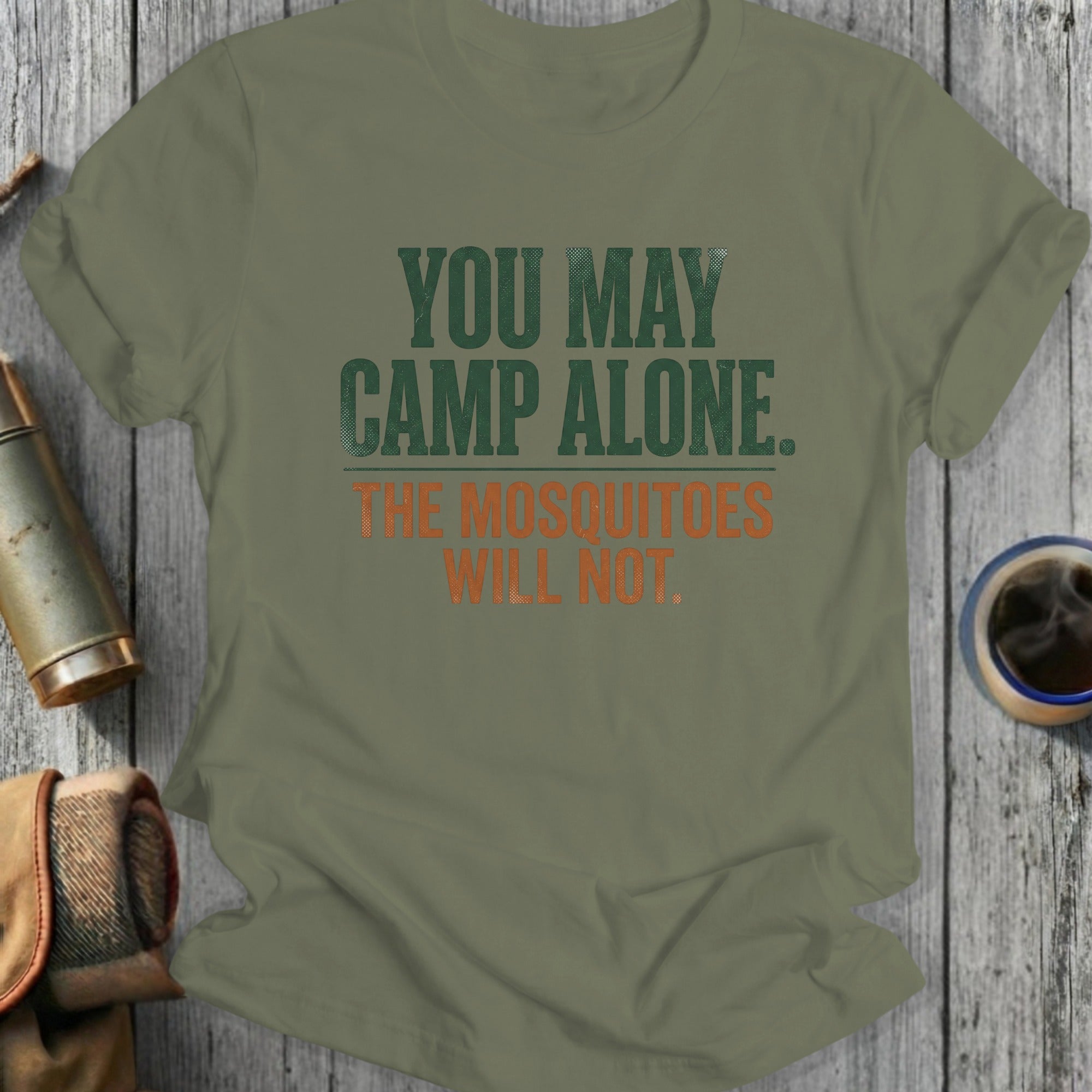 Olive green t-shirt with text "YOU MAY CAMP ALONE. THE MOSQUITOES WILL NOT."