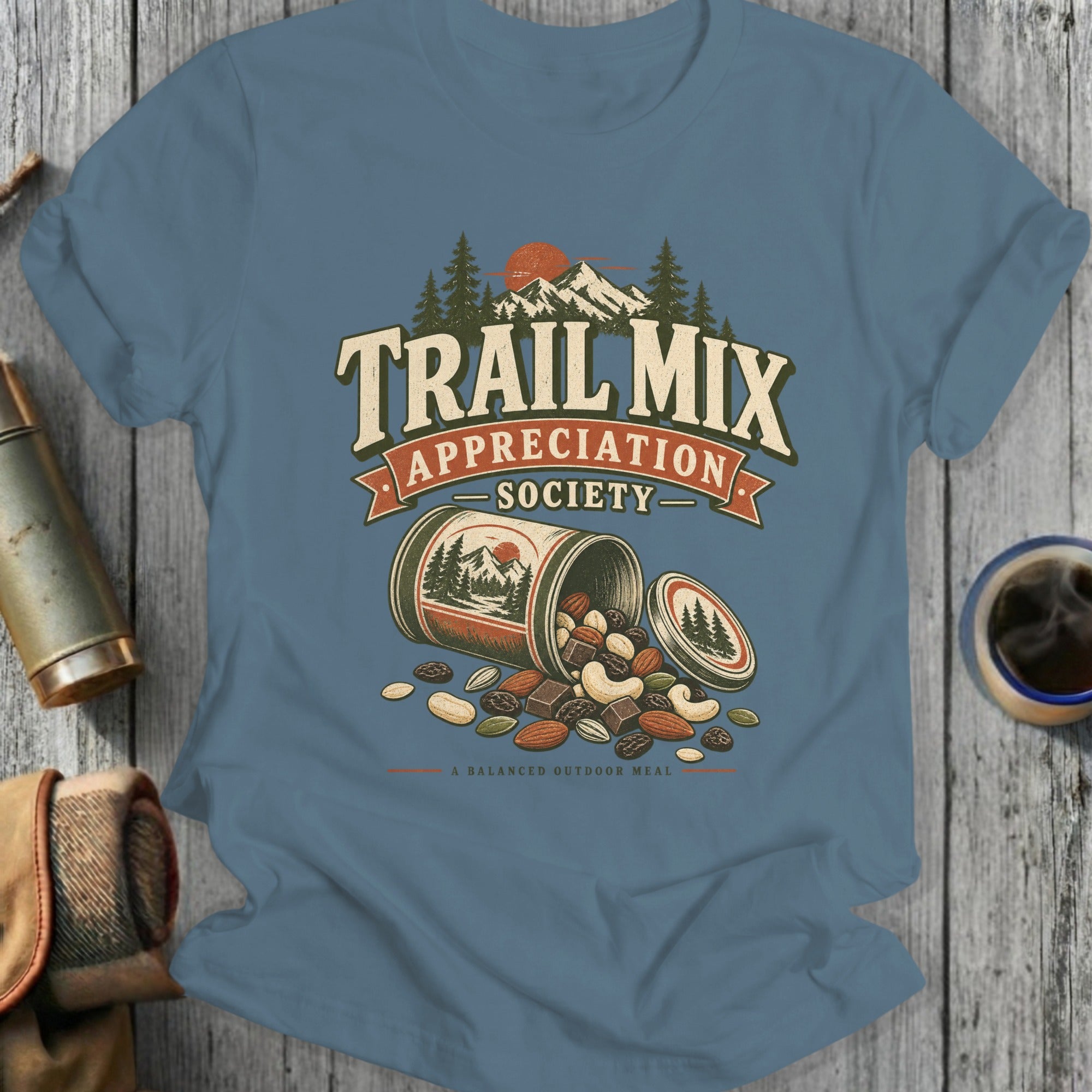T-shirt graphic with "TRAIL MIX APPRECIATION SOCIETY" and spilling can of nuts.
