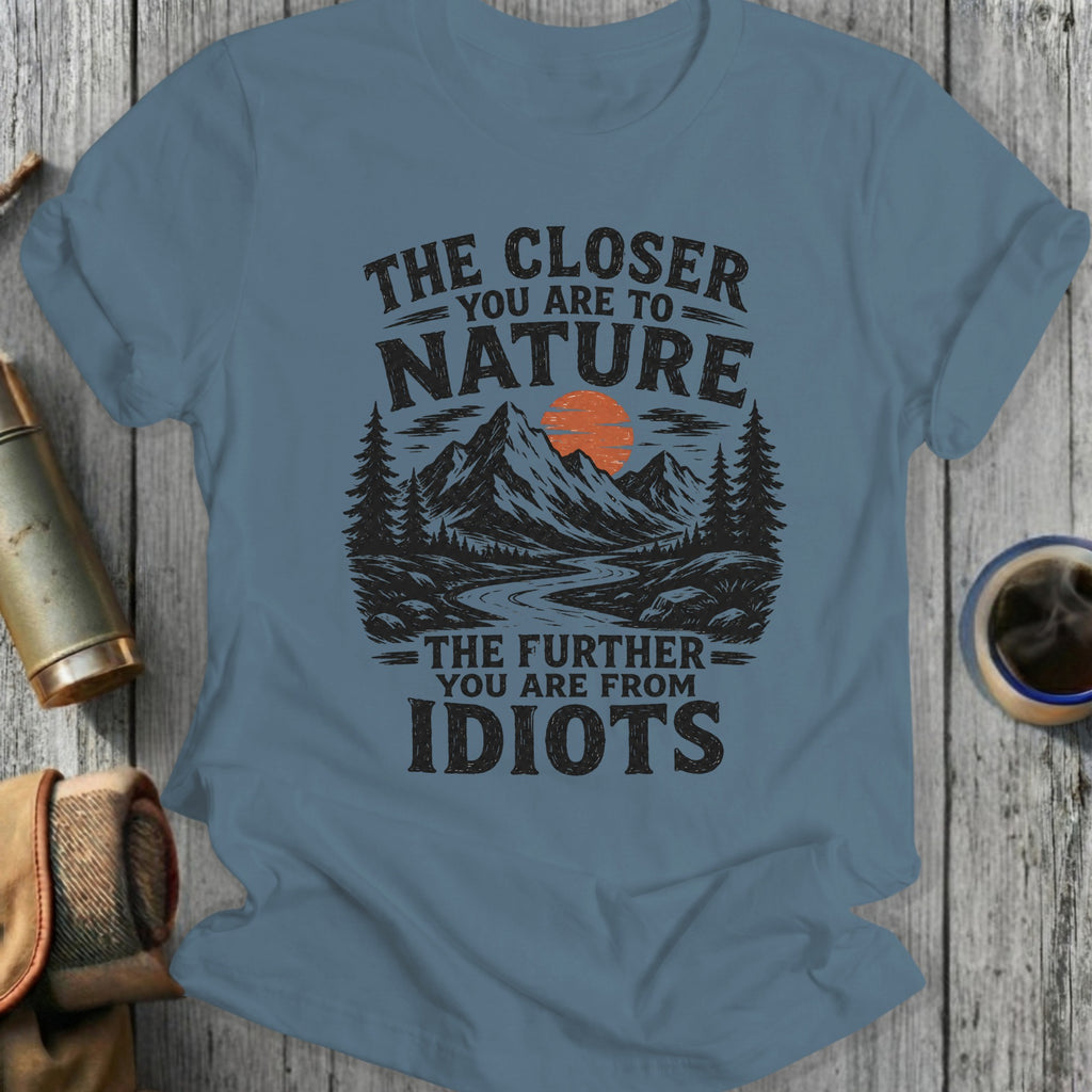T-shirt with vintage nature graphic and text "The closer you are to nature, the further you are from idiots."