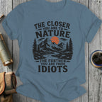 T-shirt with vintage nature graphic and text "The closer you are to nature, the further you are from idiots."