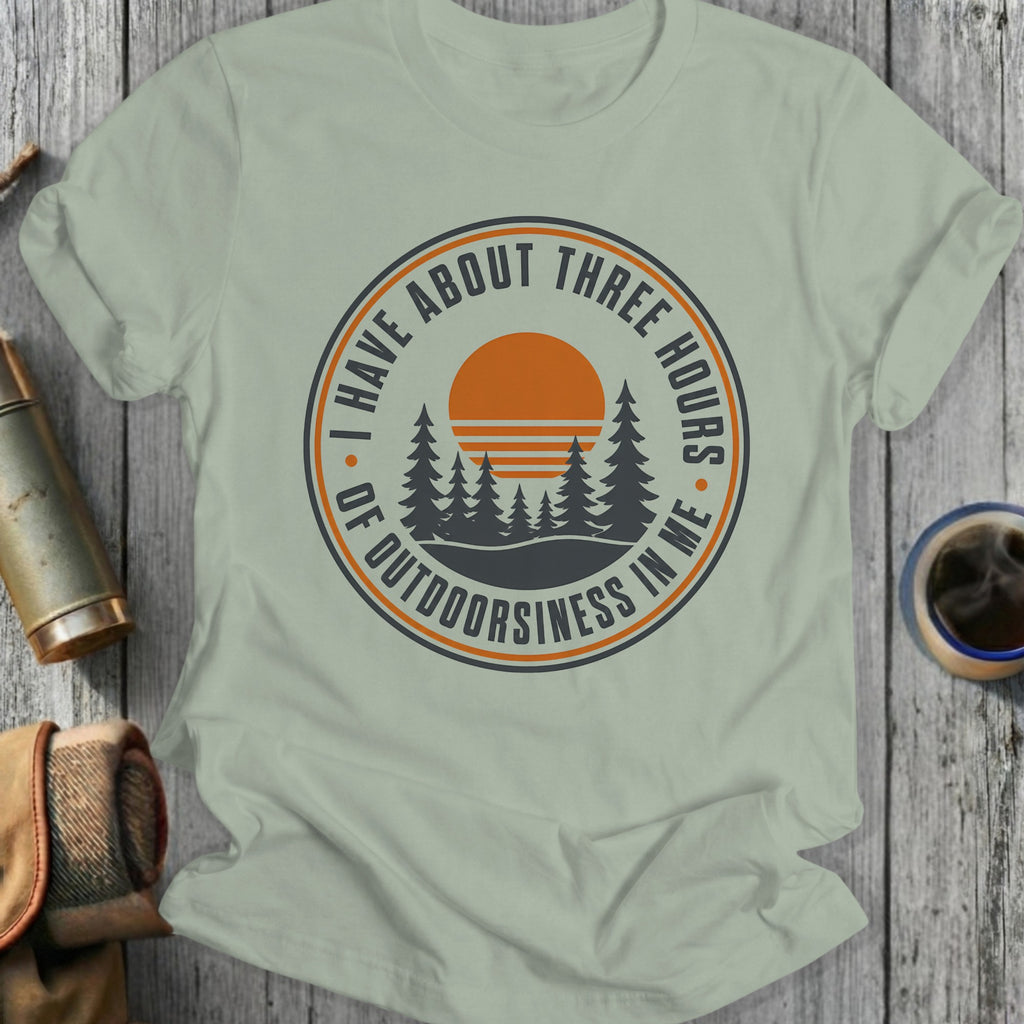 Shirt with "I Have About Three Hours Of Outdoorsiness In Me" text and a forest sunset graphic.