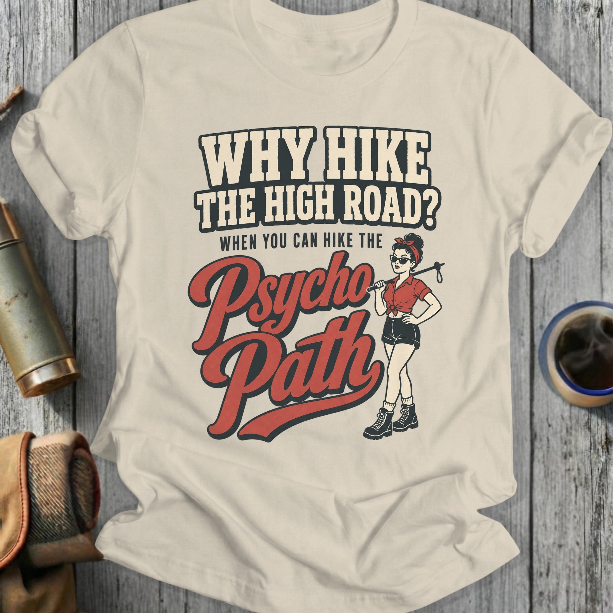 T-shirt graphic with text "Why Hike the High Road? When You Hike the Psycho Path" and a woman with hiking poles.