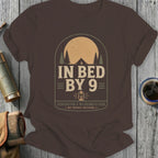 Brown t-shirt with "In Bed By 9" and wilderness club slogan.