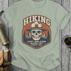 Skull wearing a park ranger hat with "Hiking" and quote.