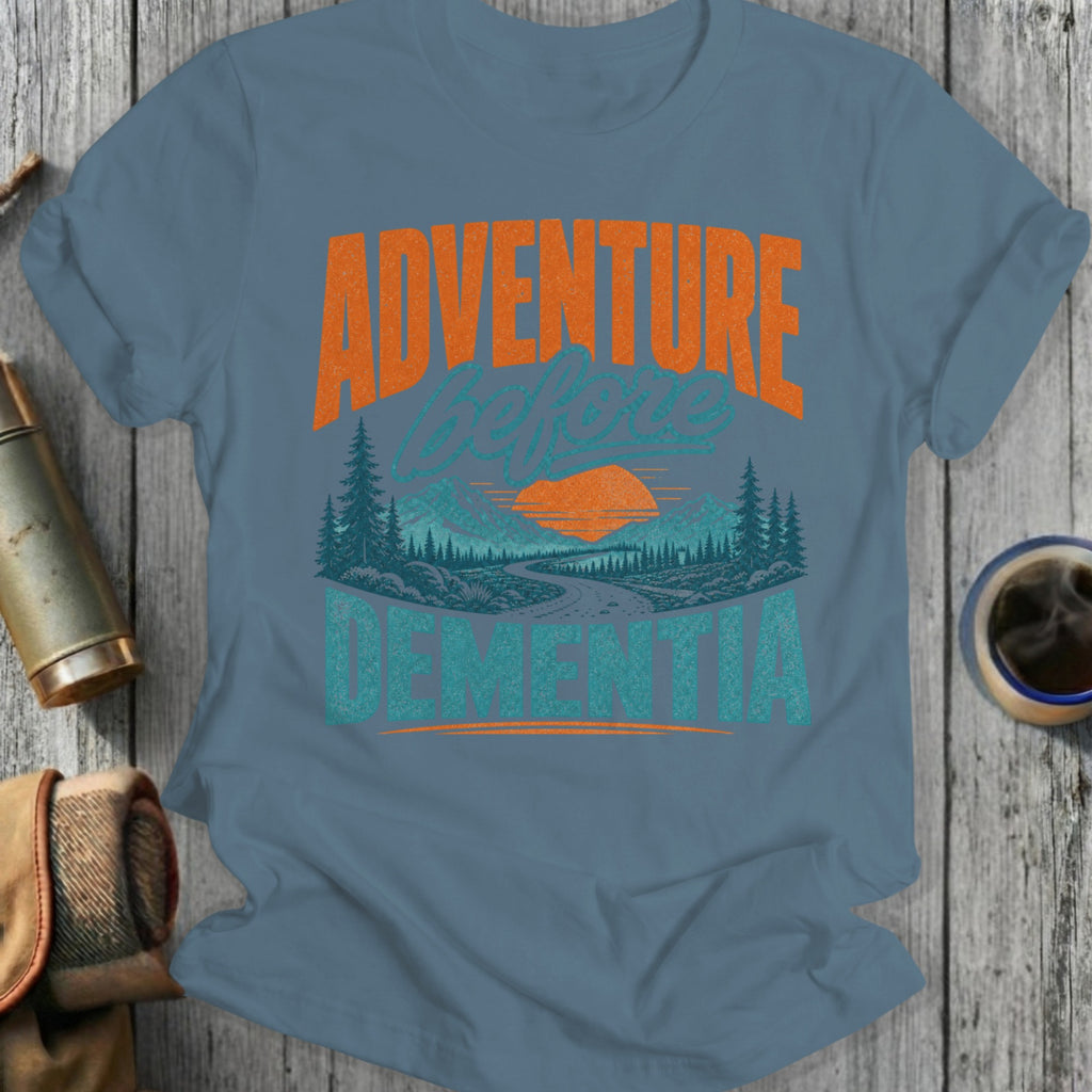 Shirt with "Adventure Before Dementia" text and mountain landscape graphic.