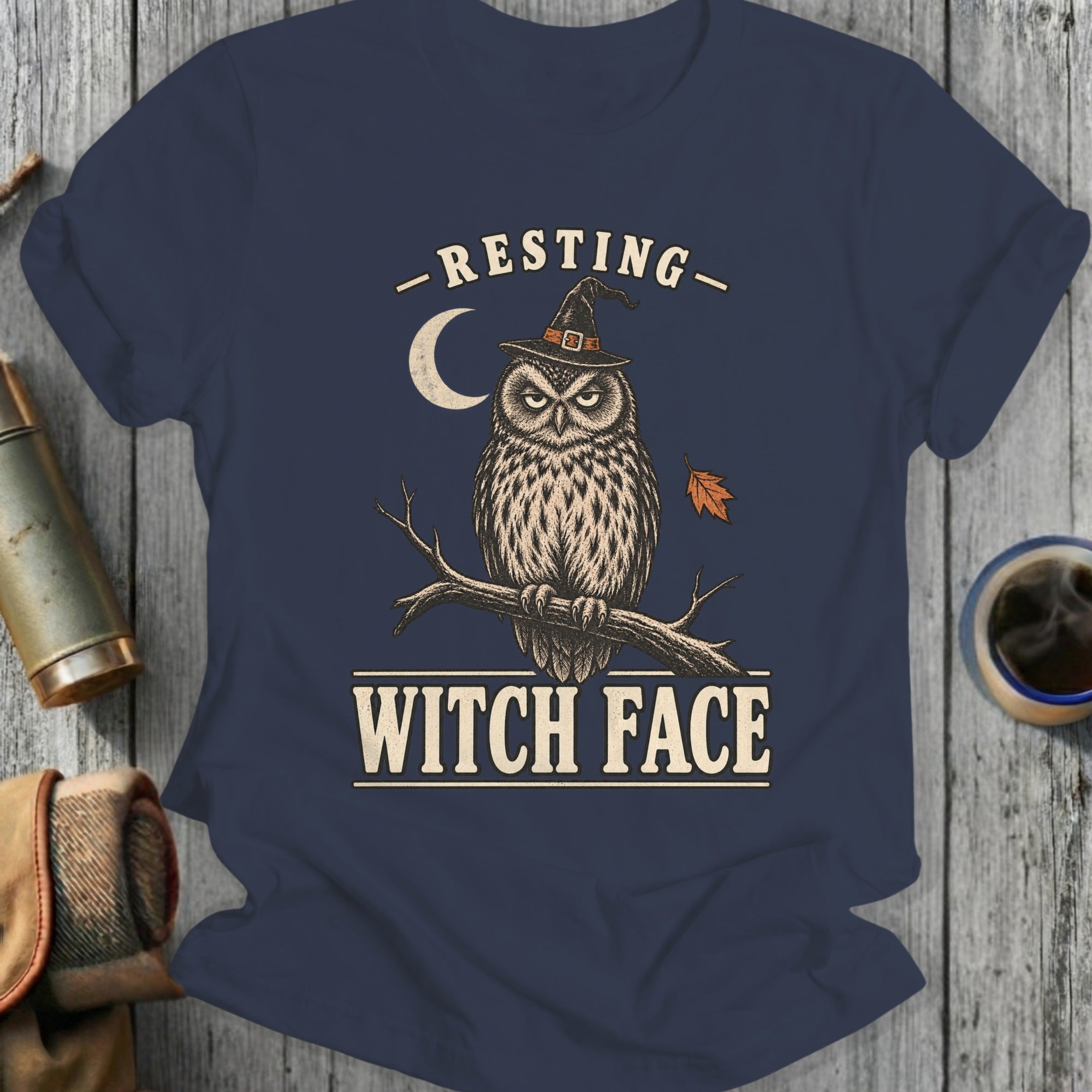 Dark blue t-shirt with an owl wearing a witch hat and the text "RESTING WITCH FACE".