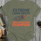 Olive t-shirt with "EXTREME LAWN DARTS 1980s BACKYARD CHAMPION" text and dart graphic.