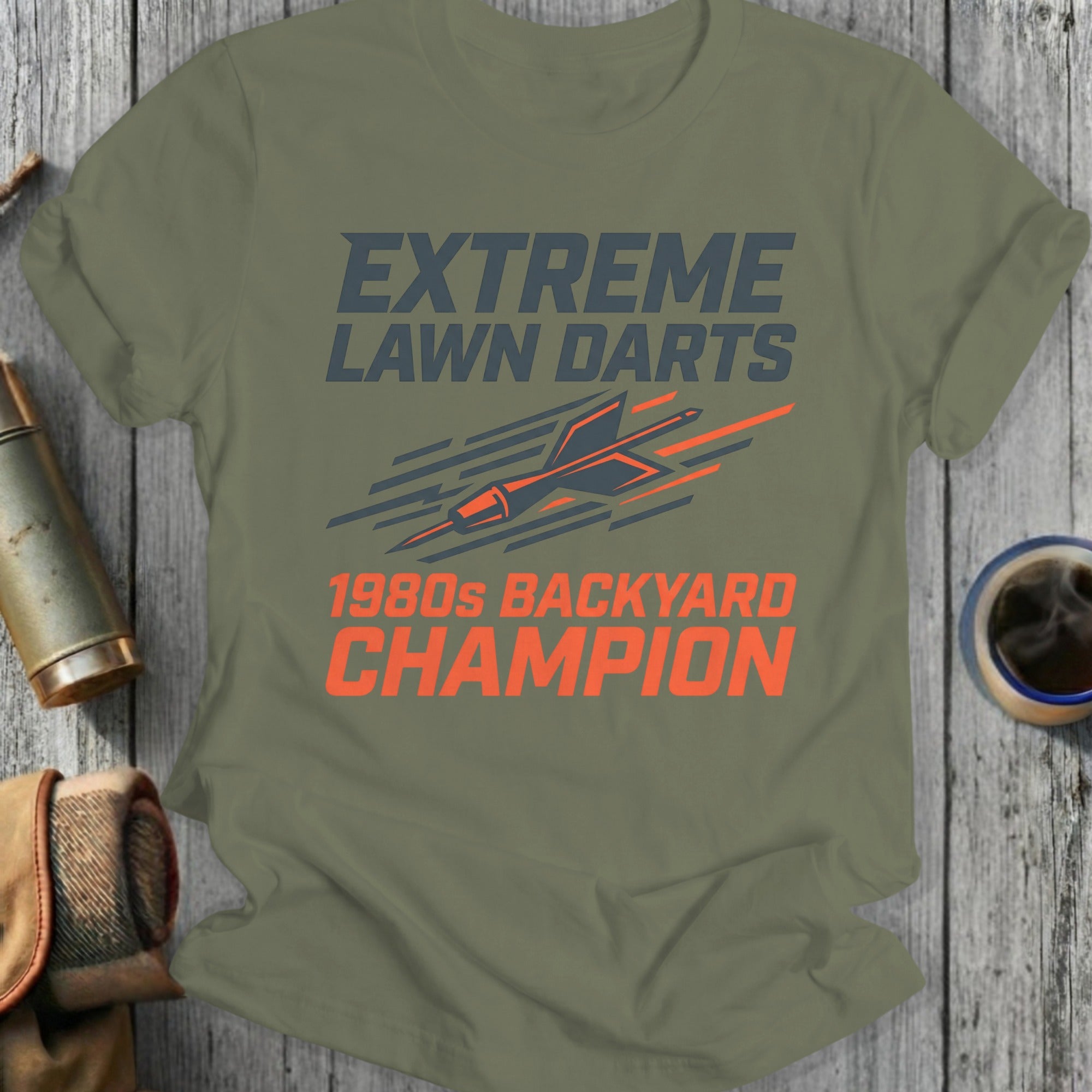 Olive t-shirt with "EXTREME LAWN DARTS 1980s BACKYARD CHAMPION" text and dart graphic.
