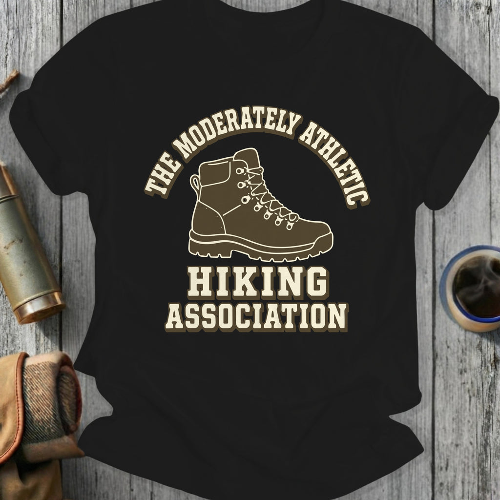 Black t-shirt design with hiking boot, "The Moderately Athletic Hiking Association" text.
