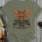Green t-shirt with 'Total Knee Destruction Tour' graphic on a wooden surface